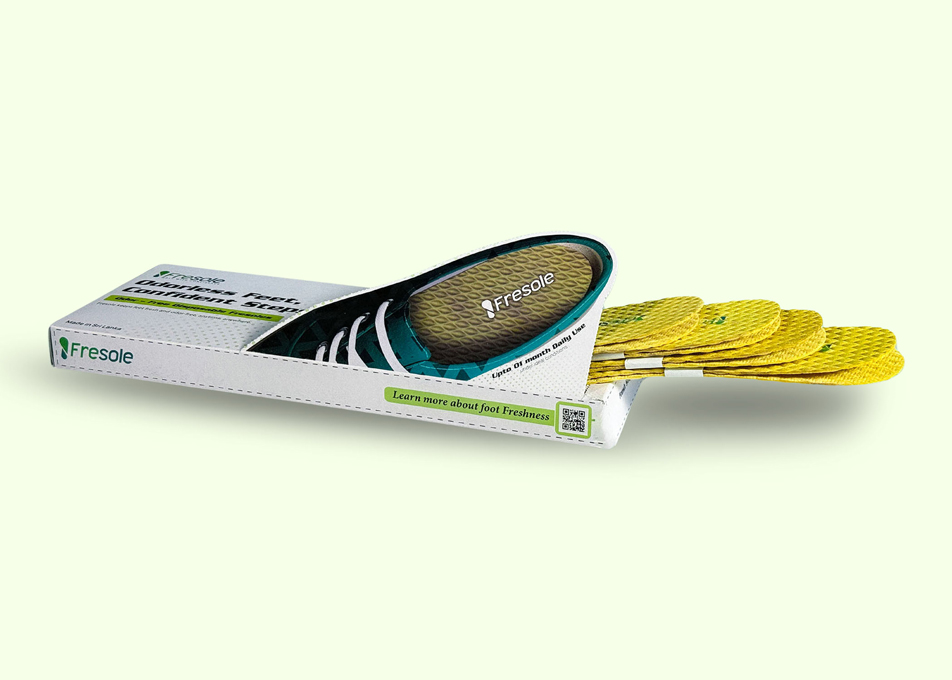 open-fresole-box-with-products-sticking-out-on-green-field